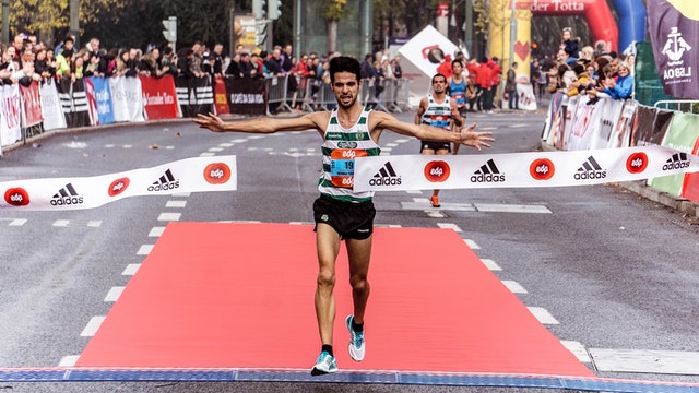 Man crossing finish line