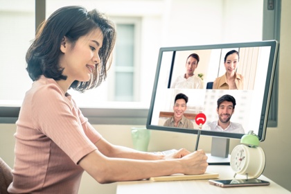 Woman on videoconference with clock