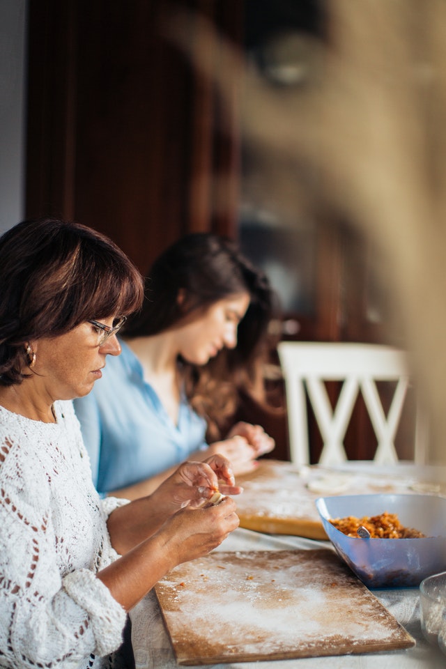 Women making pelmeni